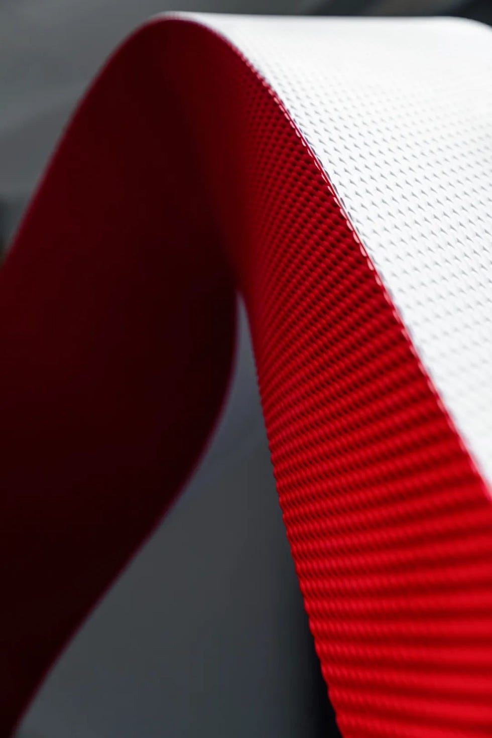 textured red and white material overlapping at an angle