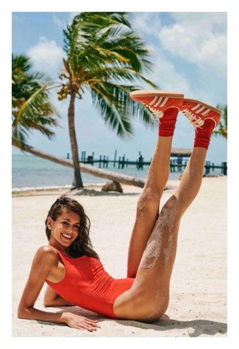 a person relaxing on a beach in a swimsuit with a tropical background