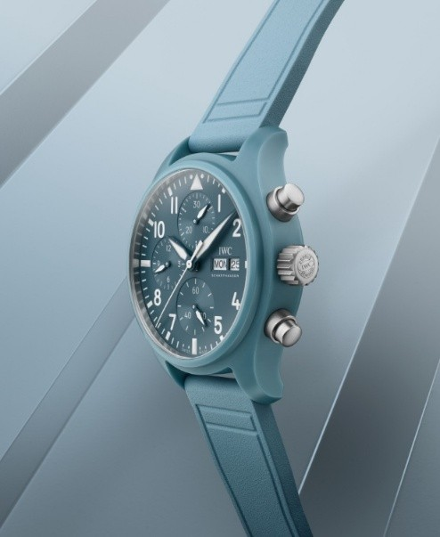 a modern chronograph watch with a blue silicone strap and dial
