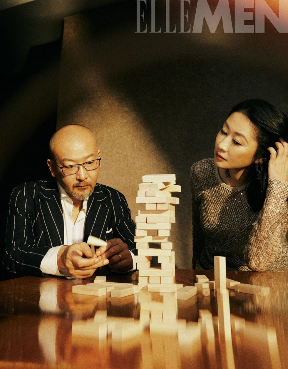 a game of jenga being played on a wooden table