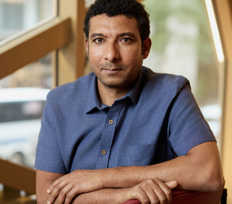 a person sitting at a welllit location with a relaxed posture
