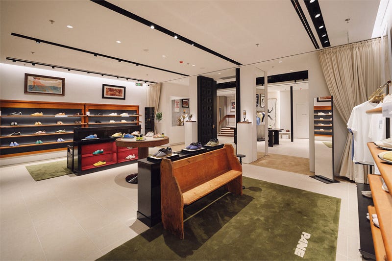 footwear retail store featuring various shoe displays and seating