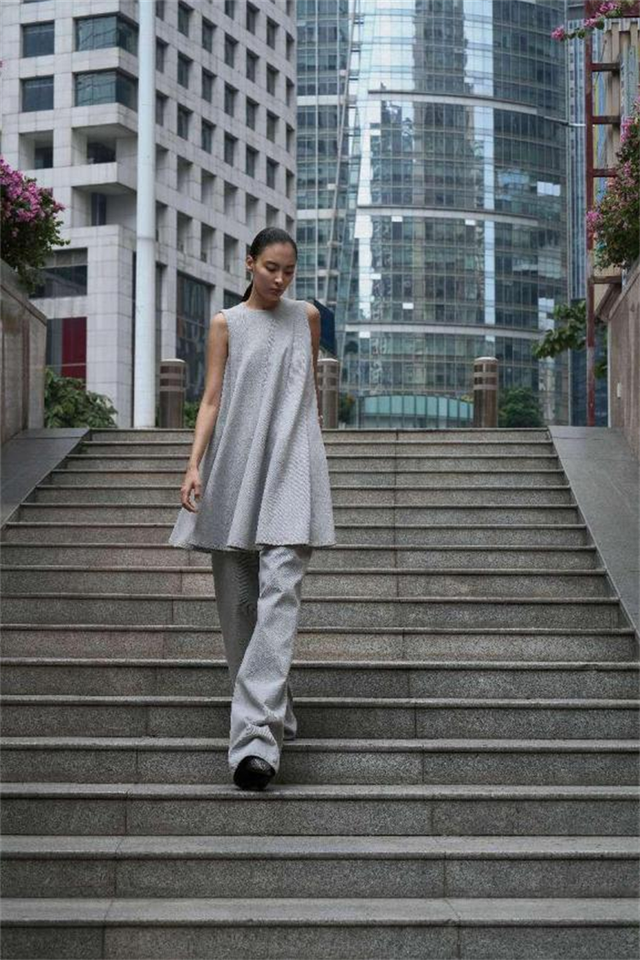 person walking down stairs in urban setting