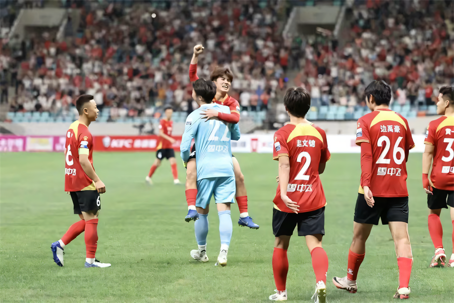 celebration among soccer players after a goal