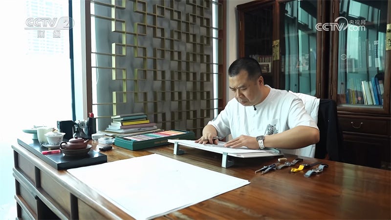a workspace with a person preparing materials for a crafting activity