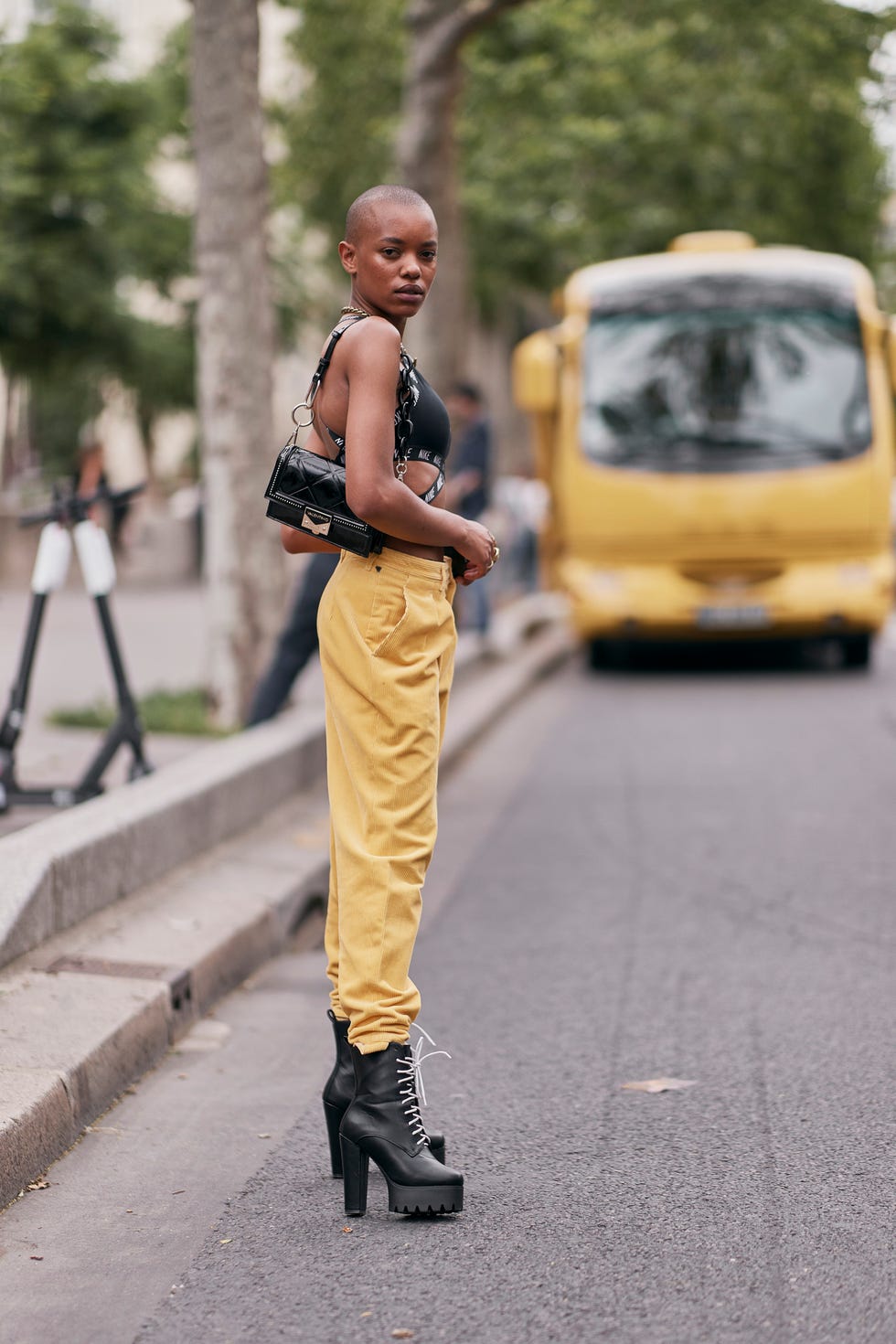 Street fashion, Yellow, Footwear, Fashion, Human, Vehicle, Personal protective equipment, Outerwear, Asphalt, Photography, 