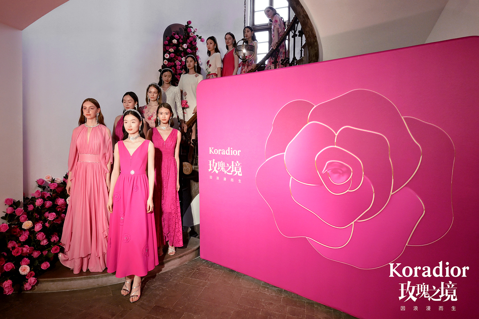 a group of women in dresses