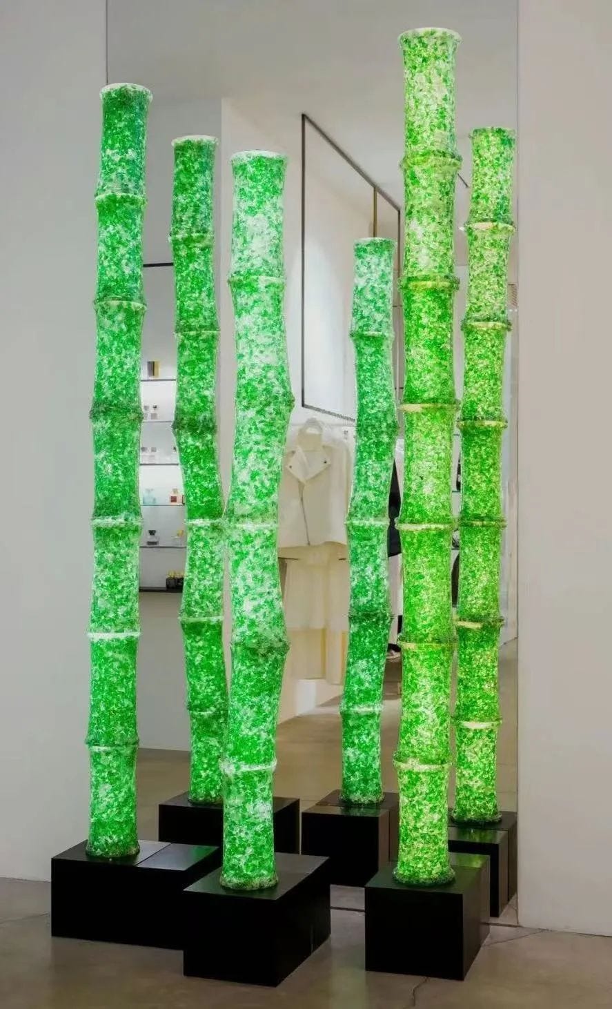 illuminated green bamboolike structures
