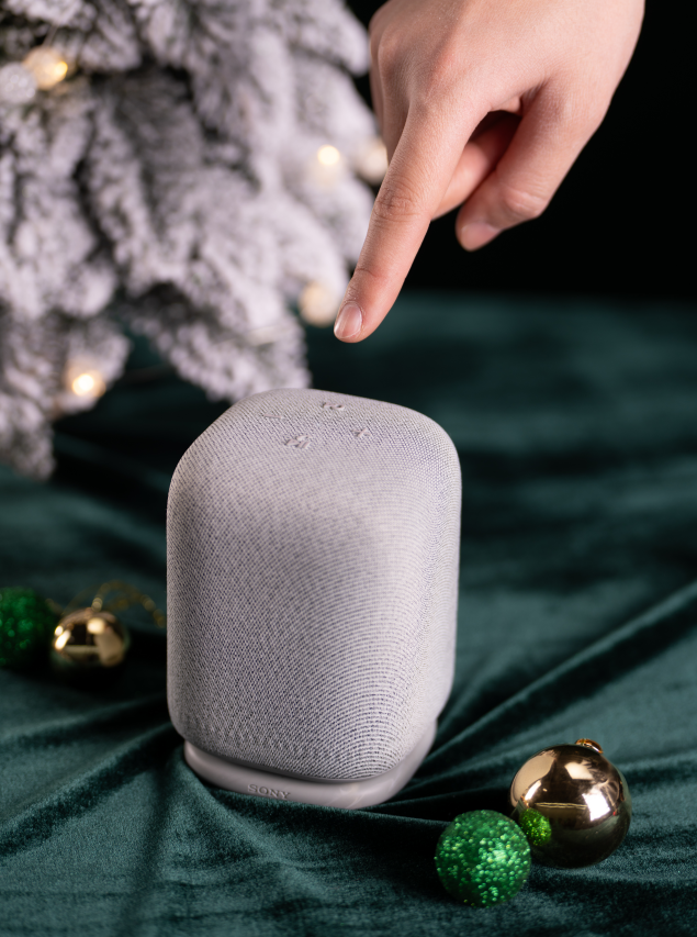 smart speaker on a table with decorative ornaments