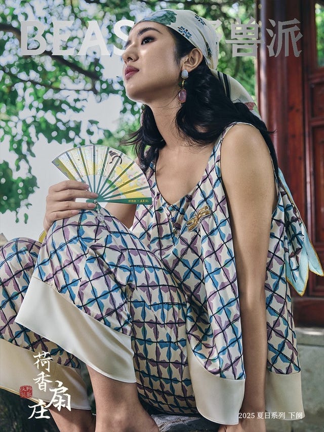 fashion model showcasing a patterned outfit while holding a fan