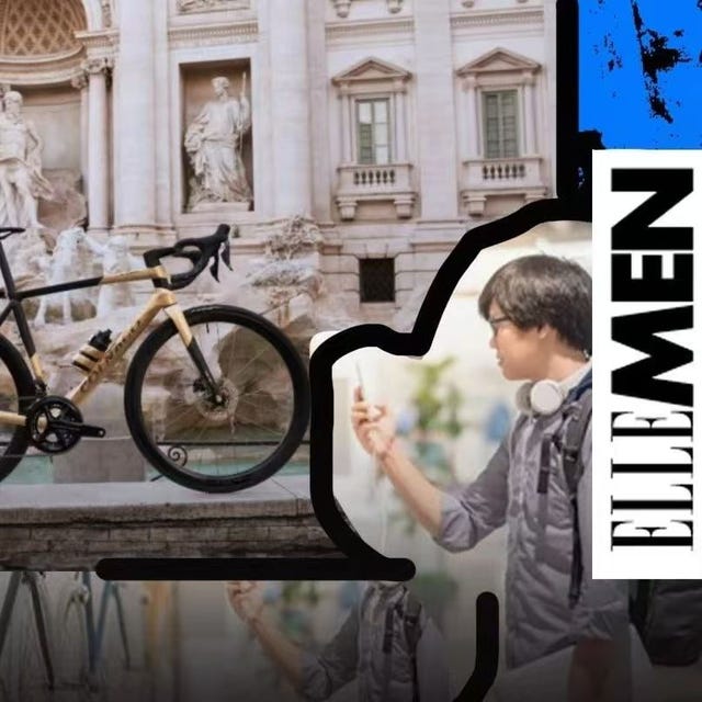a bicycle in front of a historic fountain