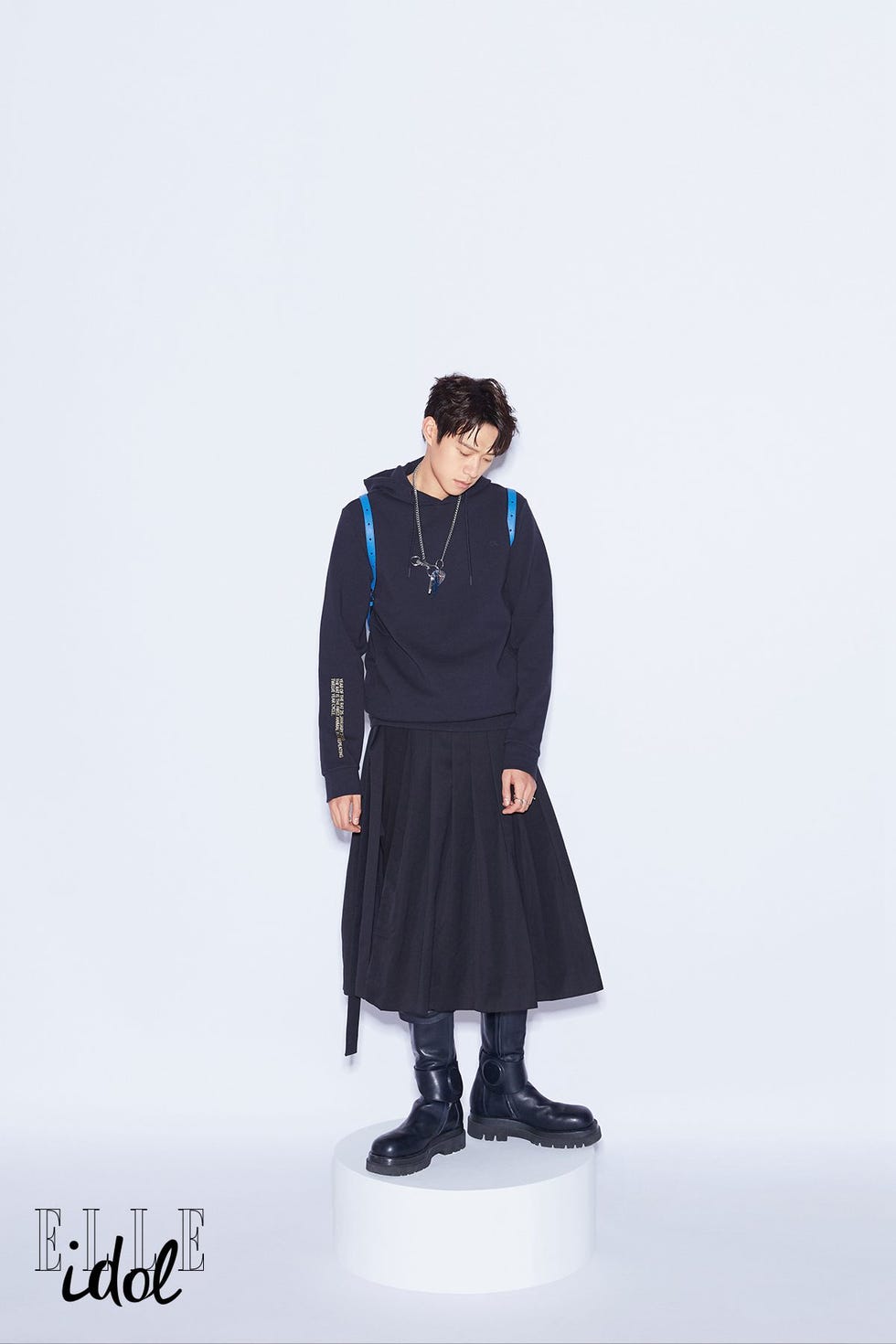 Clothing, Black, Blue, Standing, Fashion, Outerwear, Figurine, Uniform, Footwear, Sleeve, 