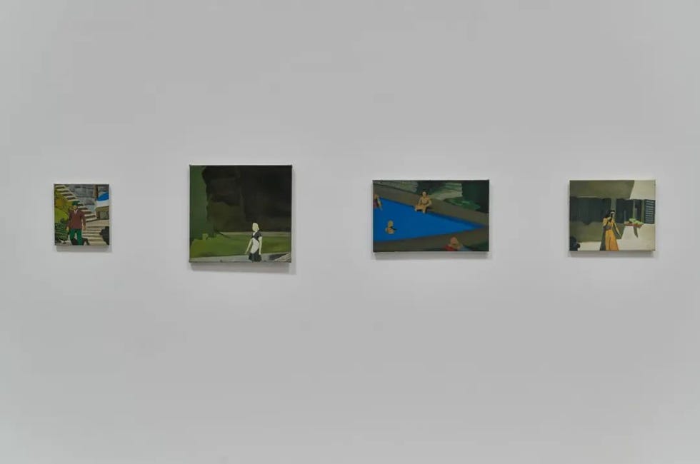 four paintings displayed on a white wall