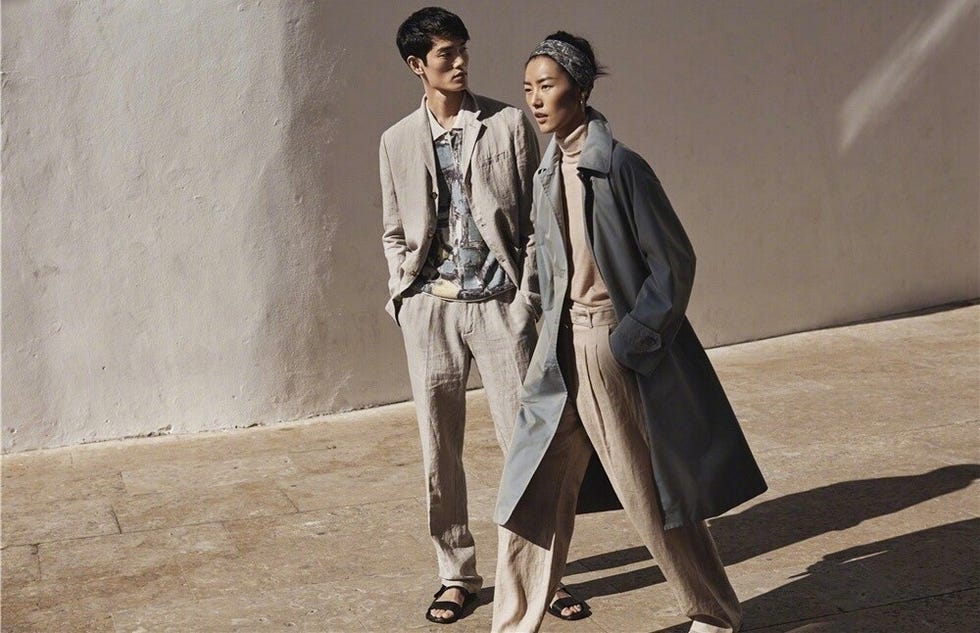 Clothing, Suit, Fashion, Standing, Trench coat, Outerwear, Coat, Fashion model, Formal wear, Overcoat, 