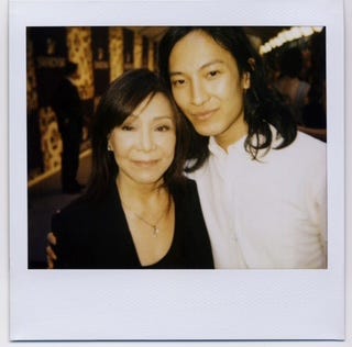 two individuals posing together at an event
