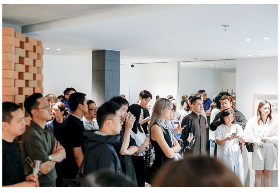 a gathering of people engaged in an event showcasing interaction and interest