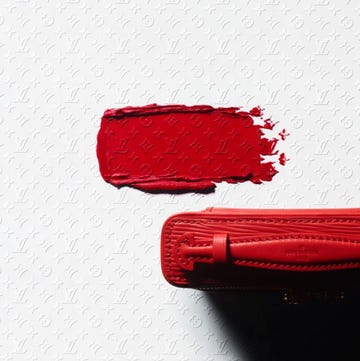 red leather bag with a paint smear of the same color red leather bag with a paint smear of the same color
