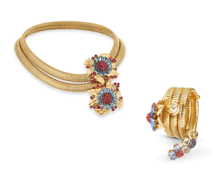 gold jewelry set featuring a necklace and bracelet with floral designs