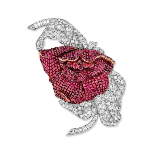 jewelry brooch designed as a rose featuring rubies and diamonds