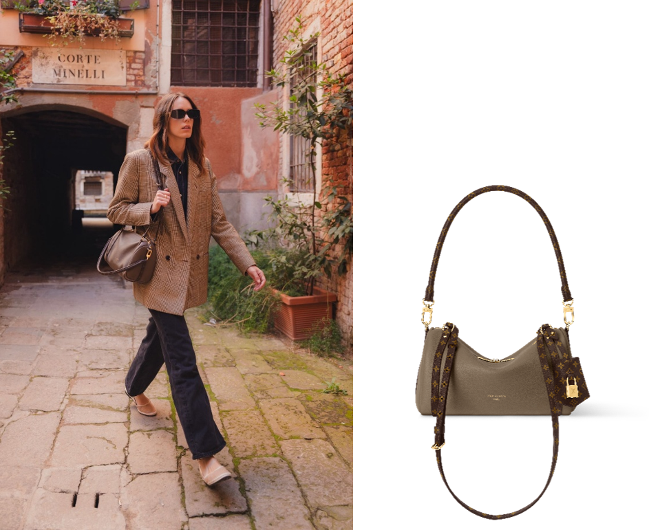 a woman walking down a cobblestone alleyway next to a handbag display