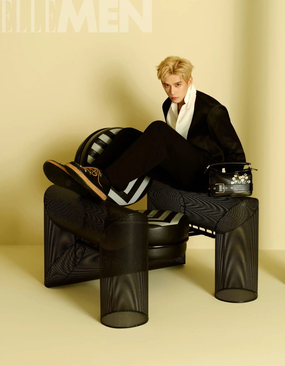a fashion composition featuring contemporary furniture and accessories