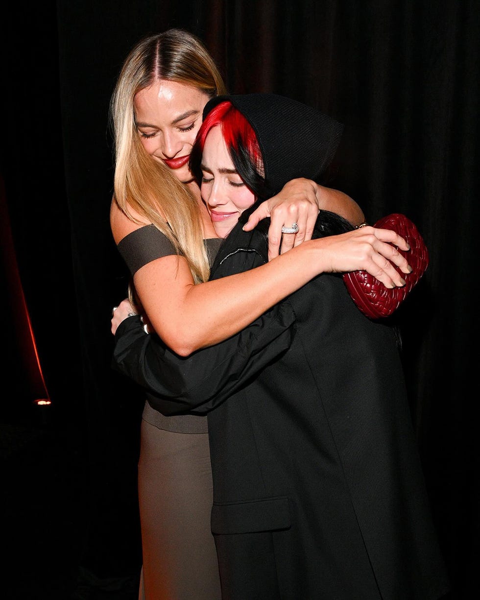 a person holding another woman