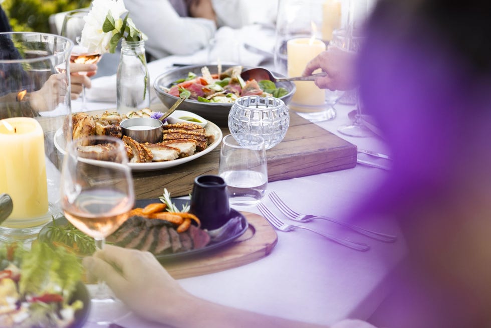 table setting with various dishes and drinks for a dining experience