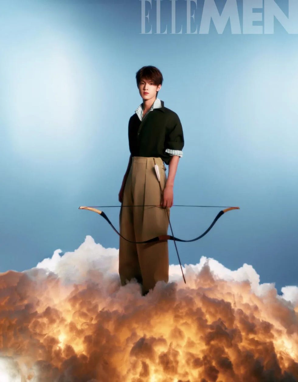 model standing on clouds with a bow and arrow