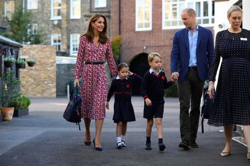 family outing with children in school uniforms accompanied by adults