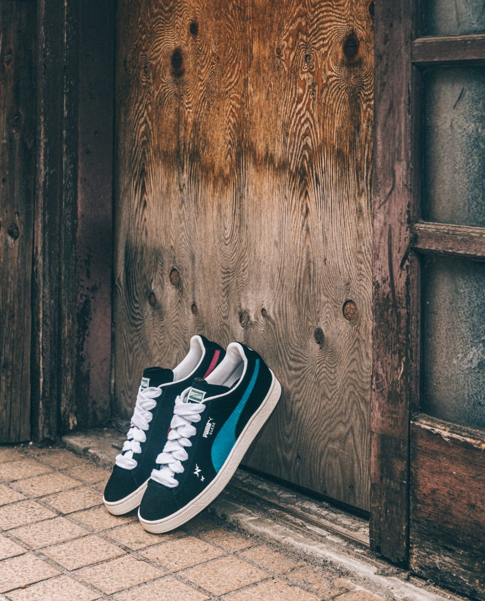 a pair of shoes on a door