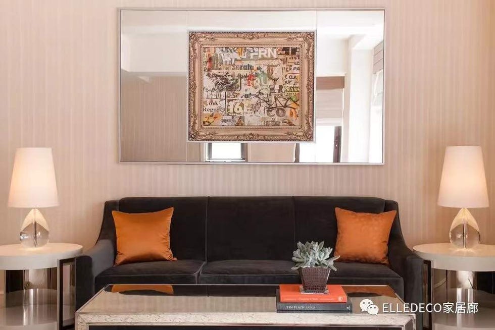 Living room, Room, Furniture, Interior design, Couch, Property, Wall, Orange, Table, Sofa bed, 