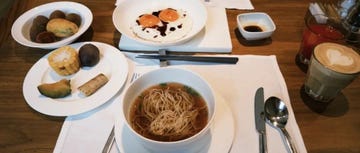 a breakfast spread featuring various dishes and beverages