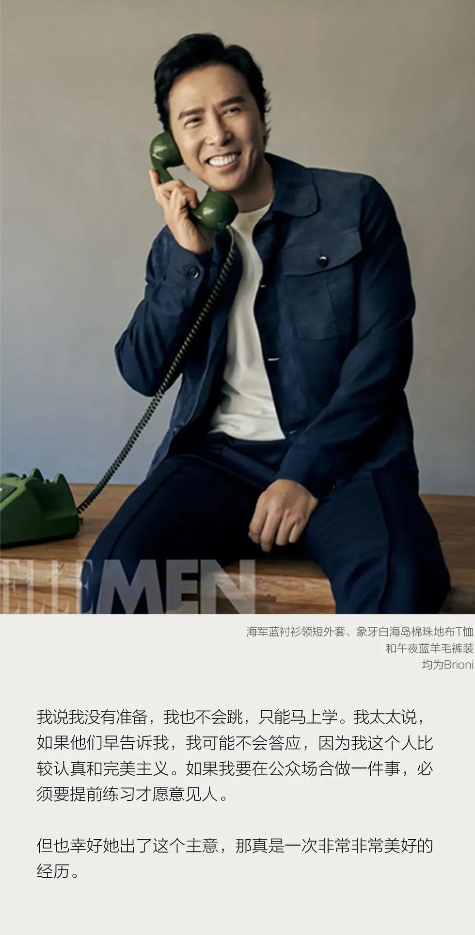 individual seated on a wooden bench holding a vintage green telephone