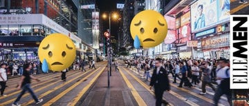 busy urban intersection at night with pedestrians crossing