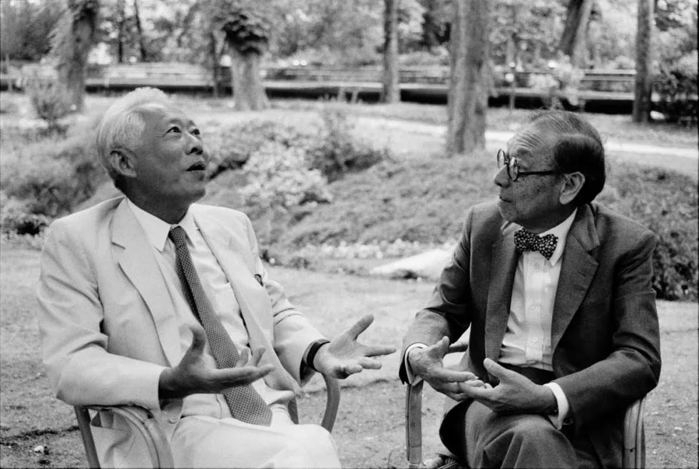 two men engaged in conversation outdoors