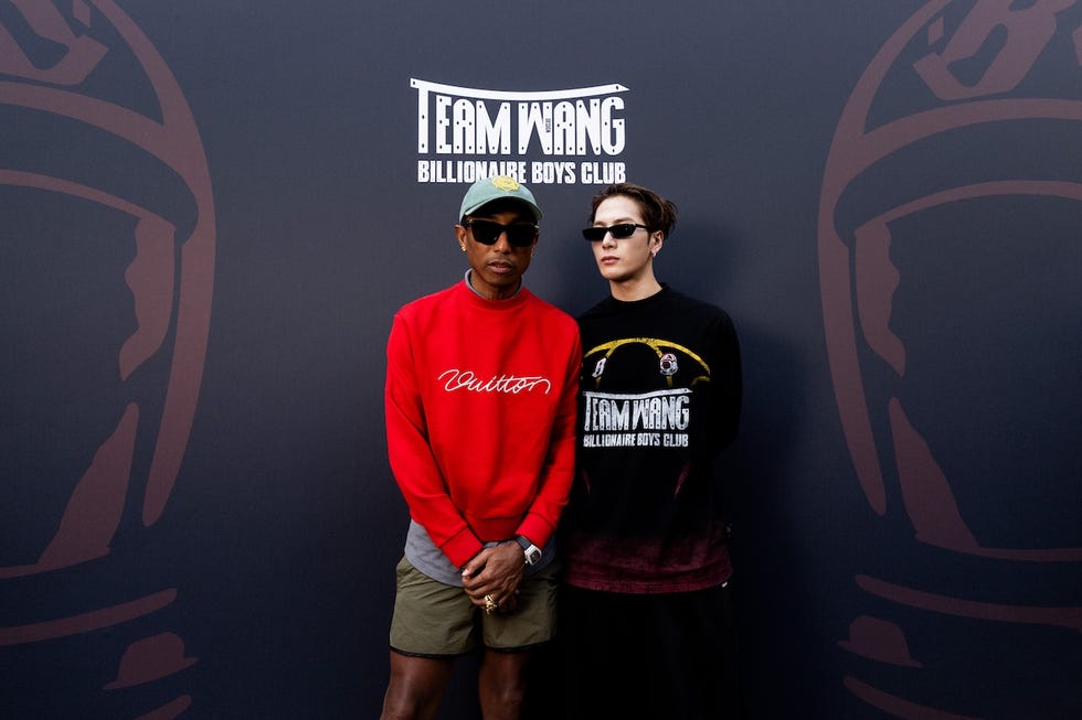 Two individuals posing together at a promotional event