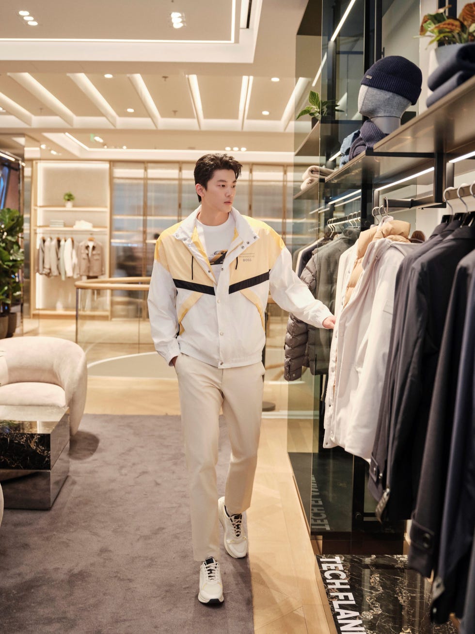 a person shopping in a modern clothing store