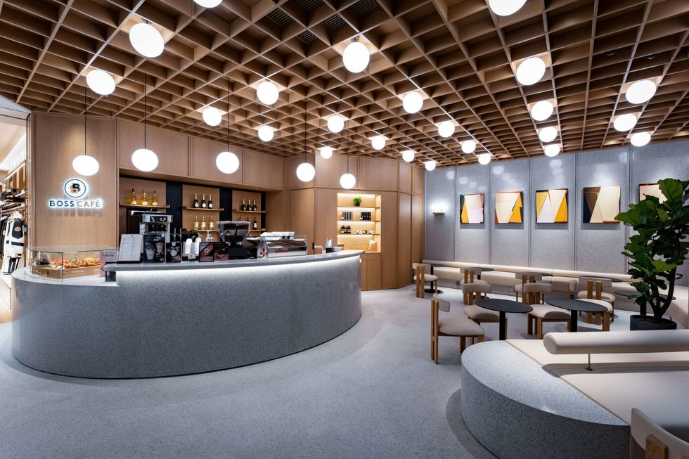 interior of a modern cafe highlighting a curved counter and seating area