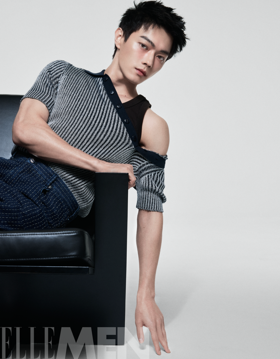 male model lounging with a stylish outfit showcasing contemporary fashion