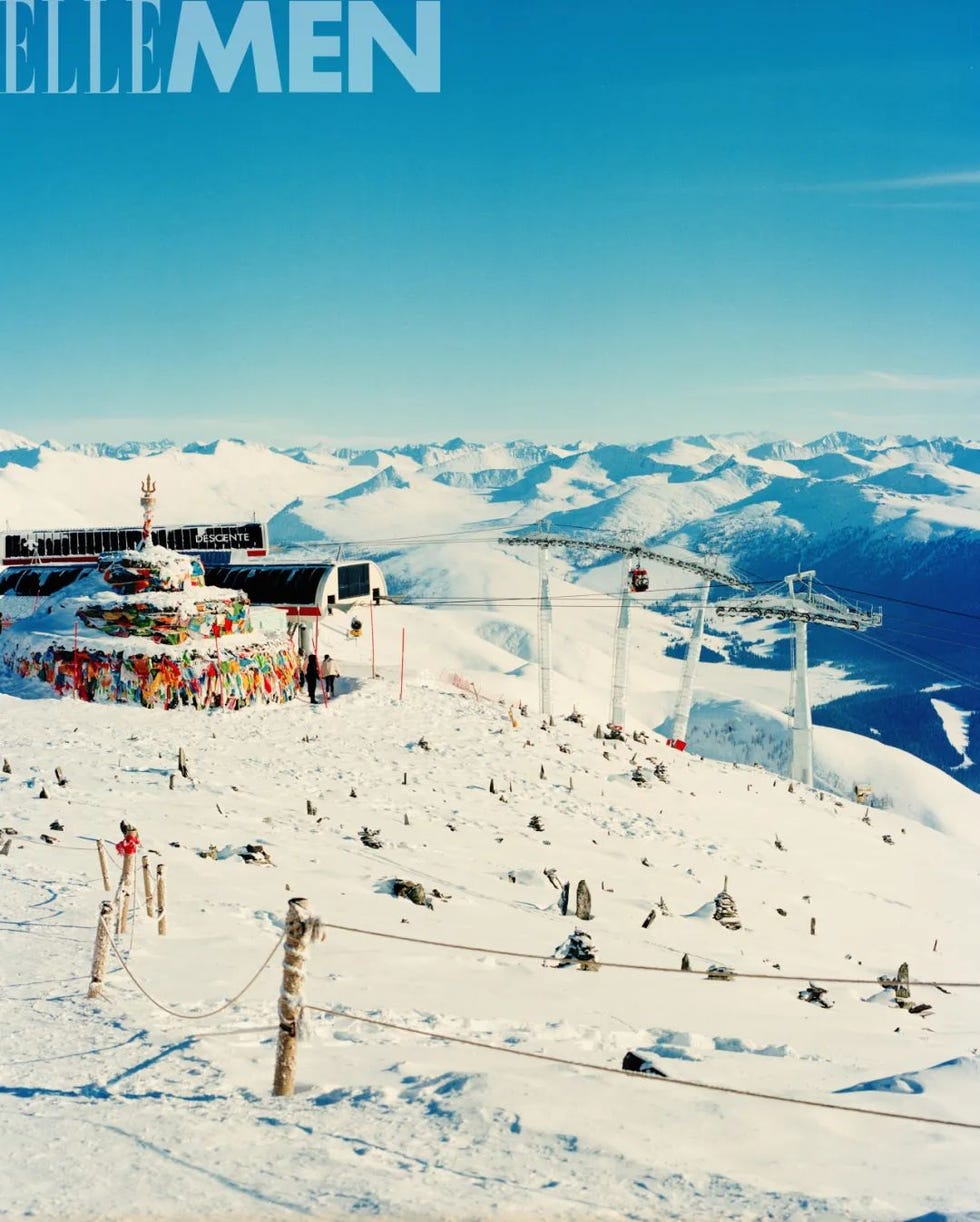 snowcovered mountain landscape featuring a colorful shrine ski lift and distant peaks