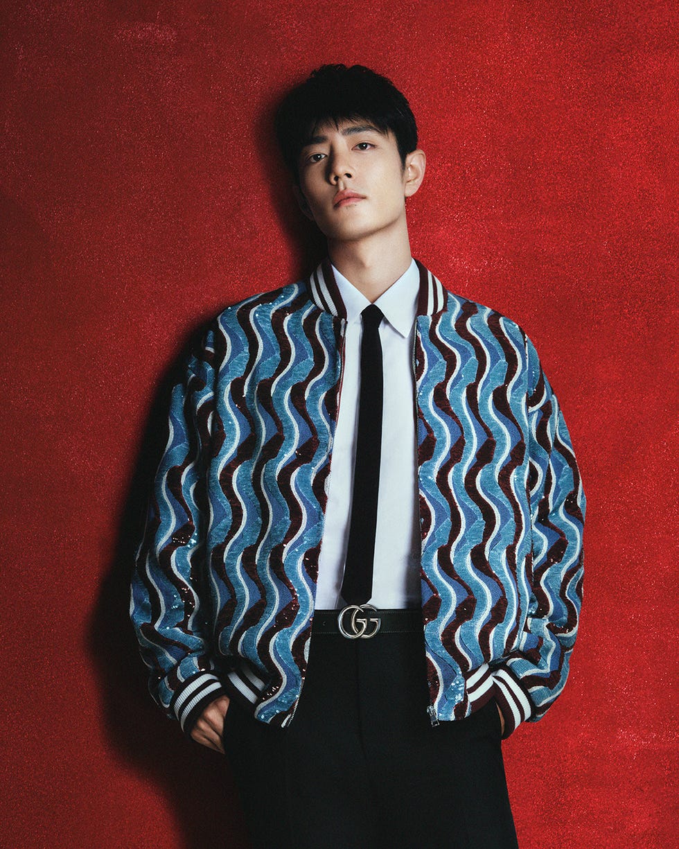 fashion ensemble featuring a patterned jacket and formal attire