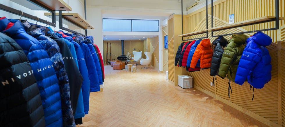 Room, Boutique, Floor, Building, Clothes hanger, Textile, Flooring, Closet, Interior design, Outlet store, 