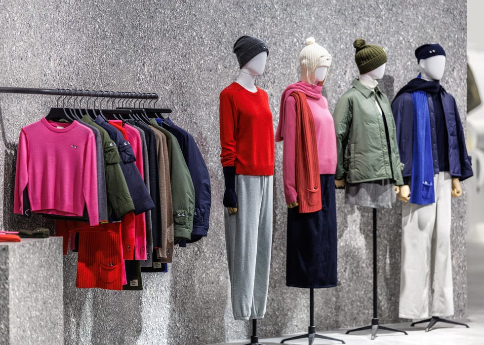 display of fashionable clothing on mannequins and hangers in a retail store