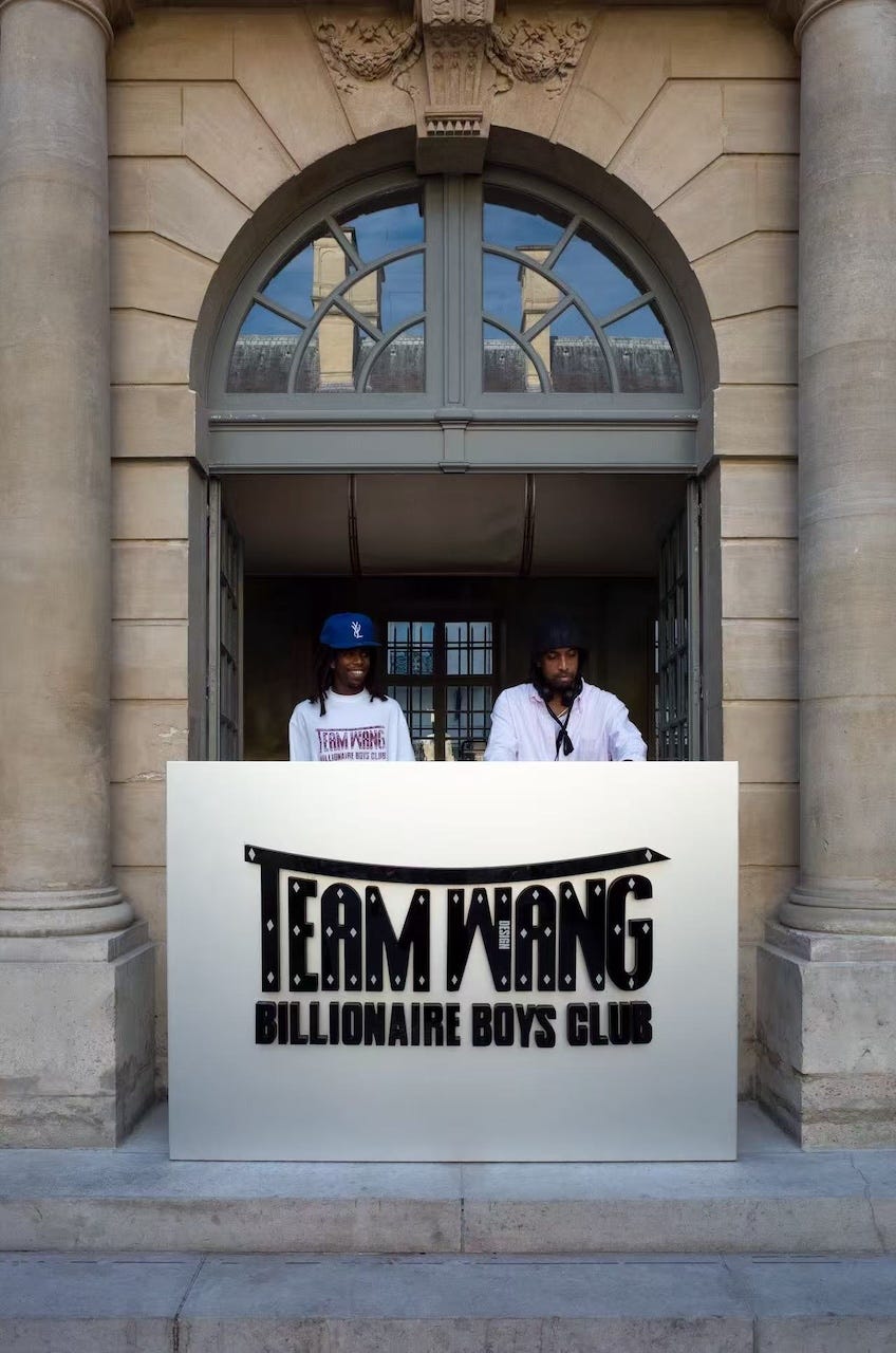 signage for team wang and billionaire boys club at a venue entrance