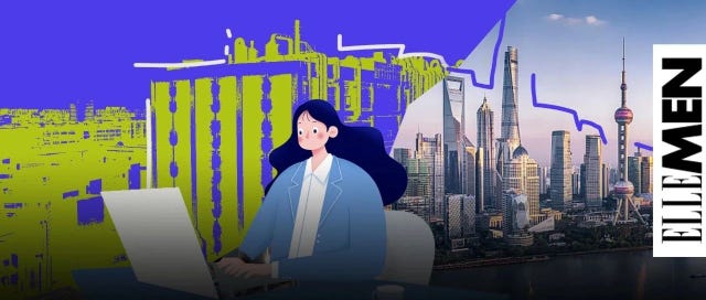 person working on a laptop with a city skyline in the background