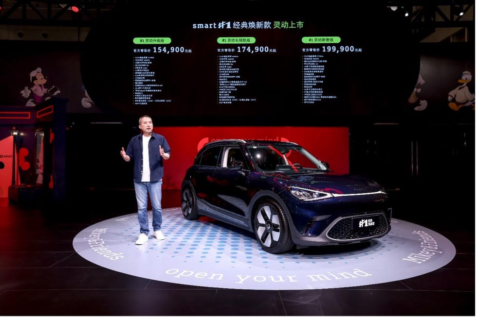 electric car model launch event with pricing details displayed