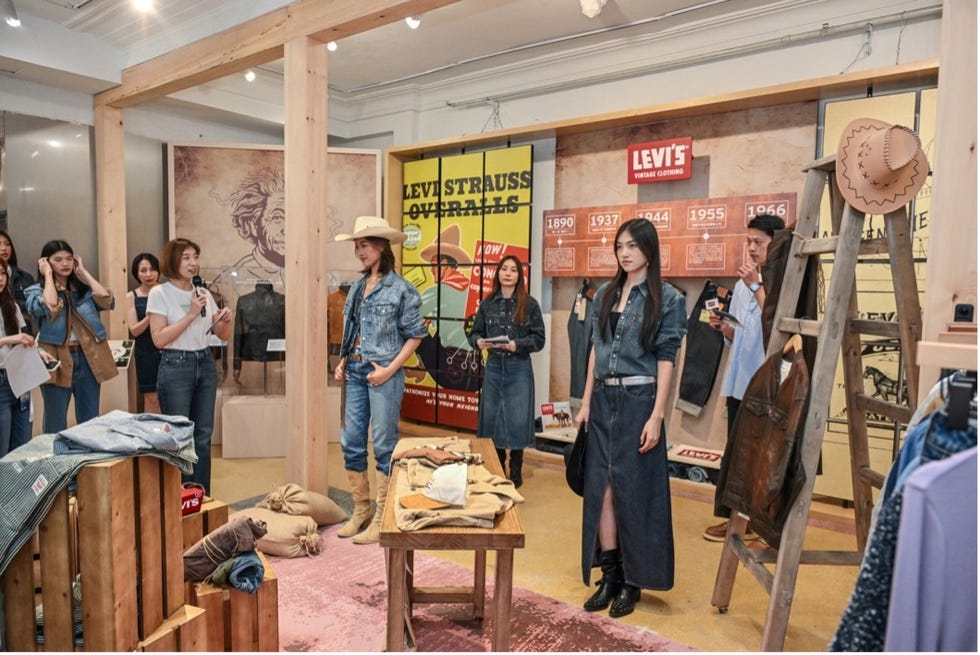 levis vintage clothing exhibit with people interacting