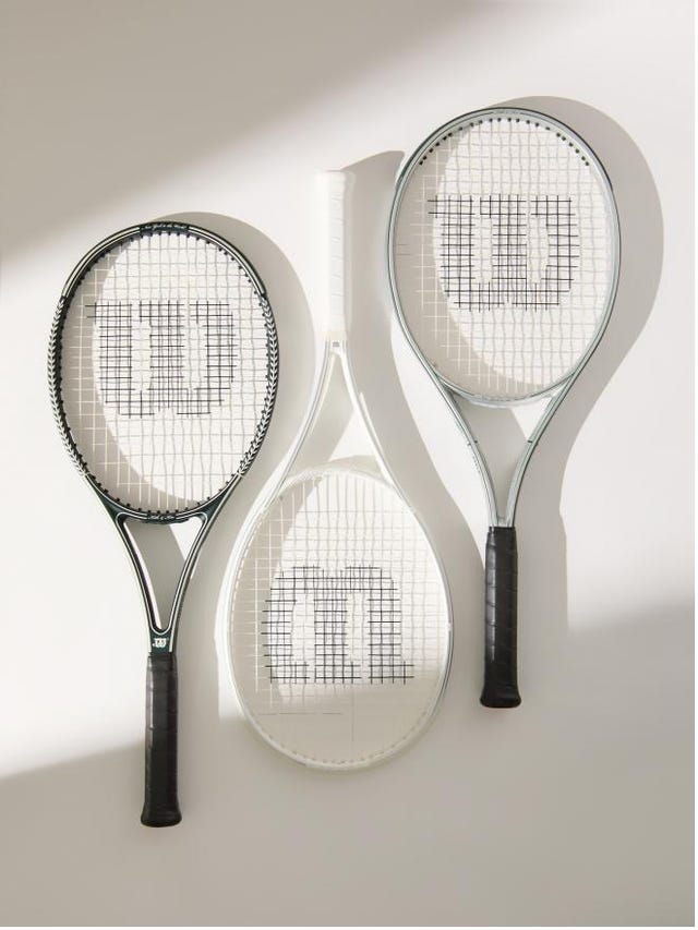 three tennis rackets arranged on a light background