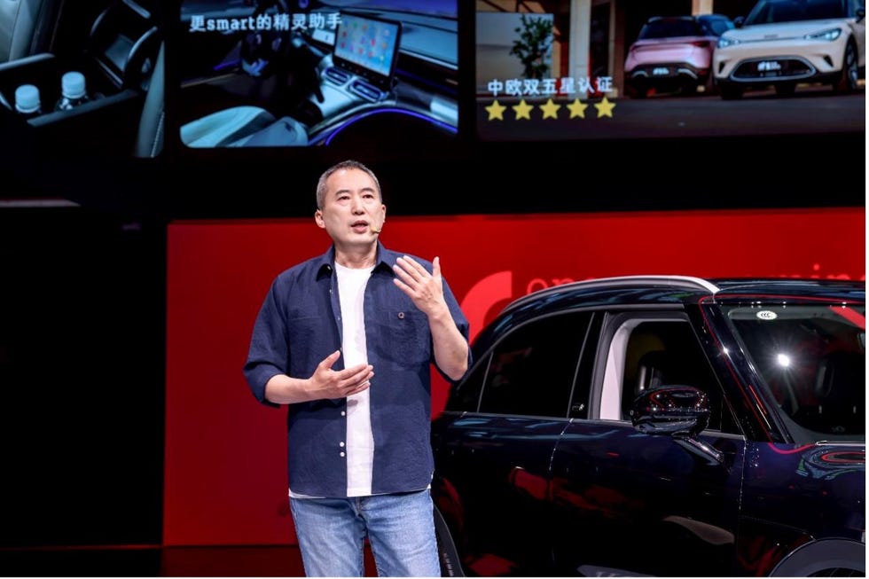 presentation by the ceo of a smart vehicle model showcasing interior features