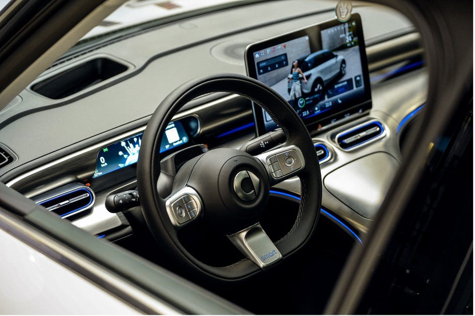 interior view of a modern car showcasing its dashboard and steering wheel features